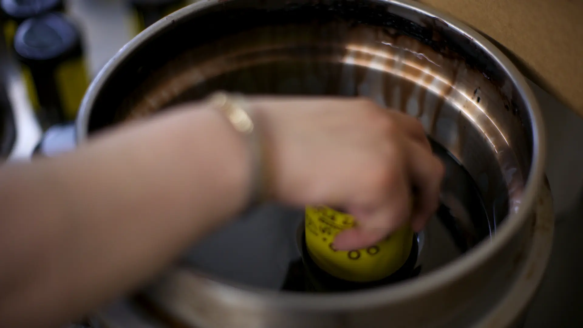 Woman dipping container lid