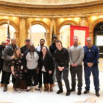 clients and staff gathered together at Massachusetts State House